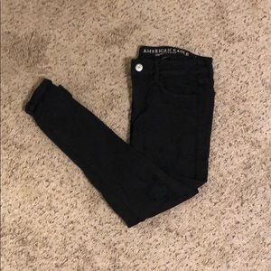 black ripped American eagle skinny jeans